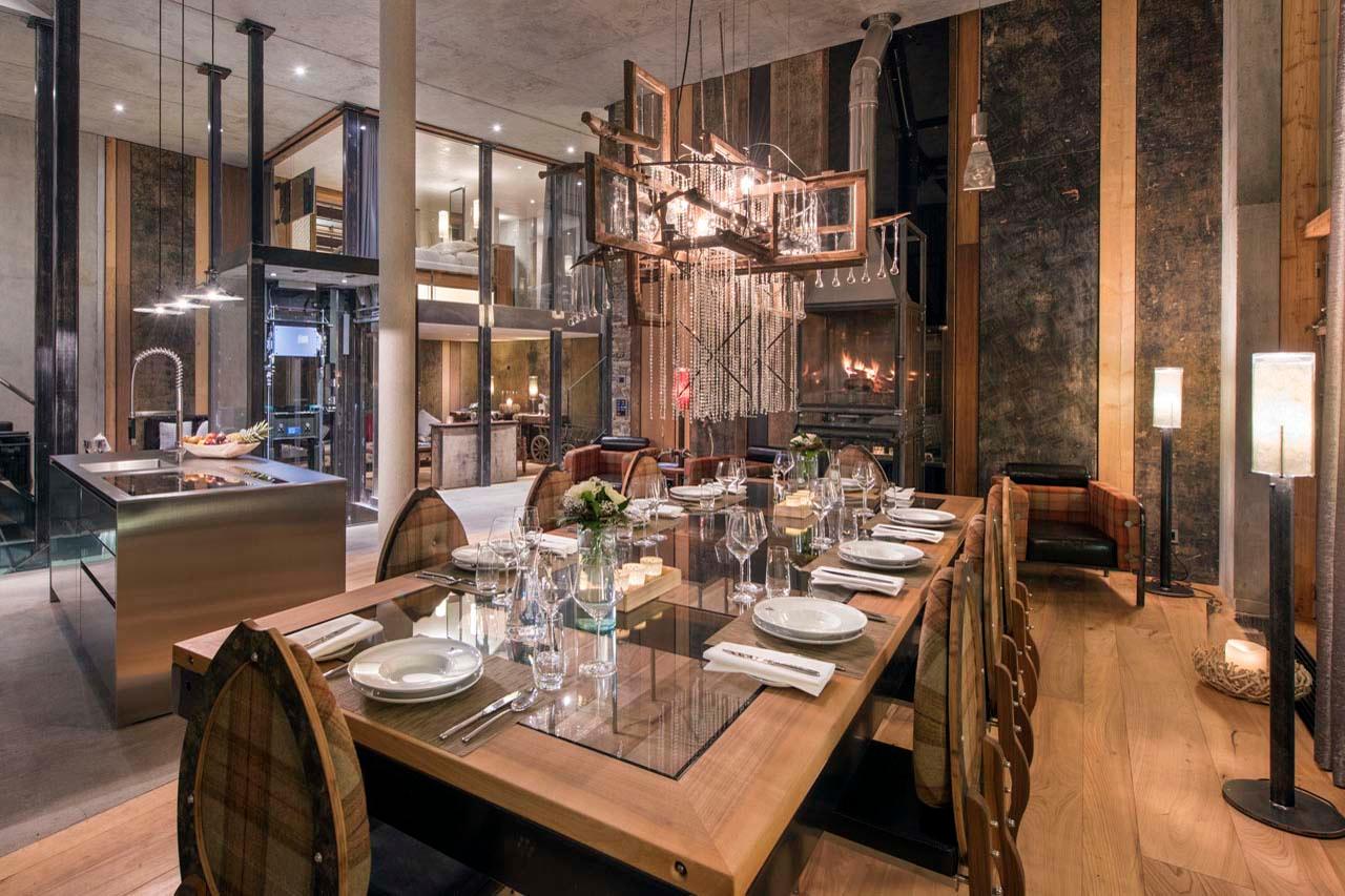 Dining are with fireplace at Backstage Luxury Loft in Zermatt