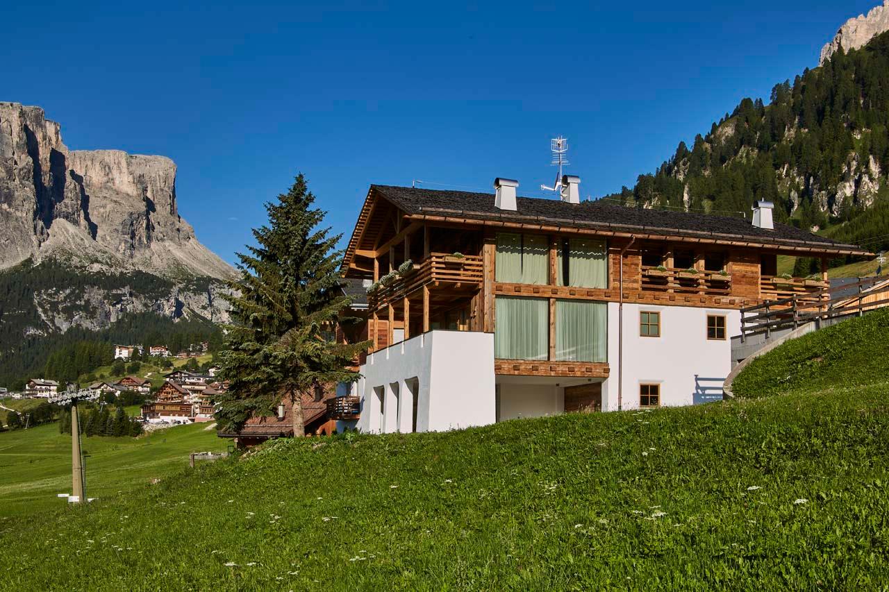 Exterior of Casa Feroze in Alta Badia in summer